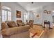 Cozy living room offers comfortable seating and bright, sunlit windows with shutters at 9562 Collinsleap Ct, Las Vegas, NV 89123