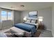 Bedroom featuring neutral walls, wood-look flooring, and scenic views from the window at 9604 Vital Crest St, Las Vegas, NV 89123