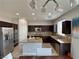 Modern kitchen featuring stainless steel appliances, a center island, and granite countertops at 9604 Vital Crest St, Las Vegas, NV 89123