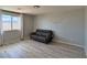 Living room featuring modern decor, a leather sofa, and plenty of natural light at 9604 Vital Crest St, Las Vegas, NV 89123