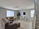Comfortable living room with wood-look floors and stylish gray sofas at 9604 Vital Crest St, Las Vegas, NV 89123