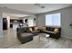 Spacious living room with hardwood floors and a comfortable seating arrangement next to the dining area at 9604 Vital Crest St, Las Vegas, NV 89123