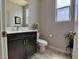 Powder room with a modern vanity and elegant fixtures at 9604 Vital Crest St, Las Vegas, NV 89123