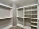 Large walk-in closet with custom organizers providing abundant shelf and rod space for optimal storage at 9604 Vital Crest St, Las Vegas, NV 89123