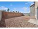 Large backyard featuring gravel landscaping, block wall fencing providing privacy and space, with potential for customization at , Las Vegas, NV 89149
