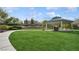 Well-maintained community park with lush green grass, sidewalks, a gazebo, mature trees and landscaping at , Las Vegas, NV 89149