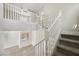 Bright and airy foyer featuring carpeted stairs and a white railing at , Las Vegas, NV 89149
