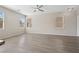 Open concept living area featuring hardwood floors, a ceiling fan, and natural light at , Las Vegas, NV 89149
