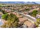 Aerial view of the neighborhood showcasing the tile roofs, landscaping, and proximity to mountains at 10009 Coral Sands Dr, Las Vegas, NV 89117