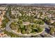 An elevated view captures the expansive community with its winding streets and serene ponds at 10009 Coral Sands Dr, Las Vegas, NV 89117