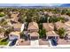 Aerial view of the home showcasing the tile roof, landscaping, and two-car garage at 10009 Coral Sands Dr, Las Vegas, NV 89117