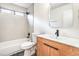 Bright bathroom featuring modern fixtures, sleek wood vanity, and patterned tile flooring at 10009 Coral Sands Dr, Las Vegas, NV 89117