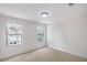 Sunlit bedroom featuring neutral carpet, fresh paint and bright windows at 10009 Coral Sands Dr, Las Vegas, NV 89117
