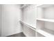 Walk in closet featuring built-in shelves and ample storage space at 10009 Coral Sands Dr, Las Vegas, NV 89117