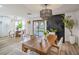 Open dining space featuring modern lighting, wood table, and access to the backyard at 10009 Coral Sands Dr, Las Vegas, NV 89117