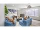 Comfortable living area with modern sofas, round coffee table, and large window at 10009 Coral Sands Dr, Las Vegas, NV 89117