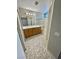 Bathroom featuring a double sink vanity, tiled floors and glass enclosed shower at 10025 Catseye Cove Ct, Las Vegas, NV 89183