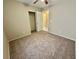 Bedroom featuring a carpeted floor and closet with an opened door at 10025 Catseye Cove Ct, Las Vegas, NV 89183