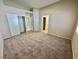 Spacious bedroom with neutral walls, carpet flooring, and ample closet space at 10025 Catseye Cove Ct, Las Vegas, NV 89183