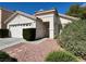 A charming single-Gathering home with a two-car garage, desert landscaping, and tile roof at 10025 Catseye Cove Ct, Las Vegas, NV 89183