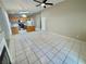 Open layout kitchen and living room area with recessed lighting, tile flooring, and modern appliances at 10025 Catseye Cove Ct, Las Vegas, NV 89183