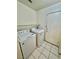 Laundry room area with a washing machine and dryer with tiled floor at 10025 Catseye Cove Ct, Las Vegas, NV 89183