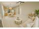 Bright living room featuring an open concept layout with kitchen, tile floors, and modern furnishings at 10025 Catseye Cove Ct, Las Vegas, NV 89183
