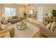 Cozy living room features comfortable seating, a neutral color palette, and plenty of natural light at 10025 Catseye Cove Ct, Las Vegas, NV 89183