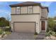 Charming two-story home featuring a two-car garage, a welcoming entryway, and low maintenance landscaping at 10029 Luna River Ave, Las Vegas, NV 89148