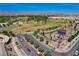 Expansive aerial view features a large park with sports facilities, trees, and streets framed by distant mountains at 1014 Solemn Cactus Ave, North Las Vegas, NV 89031