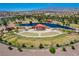 Aerial shot showcases outdoor amphitheater with a tranquil pond, perfect for community events at 1014 Solemn Cactus Ave, North Las Vegas, NV 89031