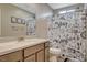 Stylish bathroom featuring a single sink vanity and a fun, playful shower curtain at 1014 Solemn Cactus Ave, North Las Vegas, NV 89031
