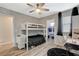 Bedroom featuring a bunk bed, ceiling fan, desk, walk in closet, and stylish decor at 1014 Solemn Cactus Ave, North Las Vegas, NV 89031