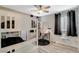 Cozy bedroom featuring a bunk bed, ceiling fan, desk, and stylish decor at 1014 Solemn Cactus Ave, North Las Vegas, NV 89031