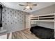 Charming bedroom features fun wall decor, ceiling fan, and a cozy bunk bed at 1014 Solemn Cactus Ave, North Las Vegas, NV 89031