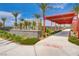 Welcoming entrance to Craig Ranch with signage, a covered walkway, and lush landscaping creating a pleasant arrival at 1014 Solemn Cactus Ave, North Las Vegas, NV 89031