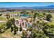 Aerial view shows well-maintained community park with playground, pond, picnic areas, and walking trails at 1014 Solemn Cactus Ave, North Las Vegas, NV 89031