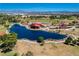 Overhead view of a serene community pond surrounded by lush landscaping and open green spaces at 1014 Solemn Cactus Ave, North Las Vegas, NV 89031