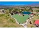 Overhead shot features a peaceful community pond with walking paths and green lawns at 1014 Solemn Cactus Ave, North Las Vegas, NV 89031