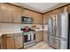 Well-equipped kitchen boasting stainless steel appliances, ample cabinet space, and modern design elements at 1014 Solemn Cactus Ave, North Las Vegas, NV 89031