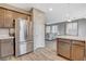 Bright and airy kitchen seamlessly transitions into the living space with stainless appliances and natural light at 1014 Solemn Cactus Ave, North Las Vegas, NV 89031