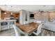 Inviting open-concept living space featuring a spacious dining area and modern kitchen with stainless appliances at 1014 Solemn Cactus Ave, North Las Vegas, NV 89031