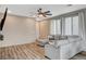 Comfortable living area with wood floors, neutral walls, and large windows for natural light at 1014 Solemn Cactus Ave, North Las Vegas, NV 89031