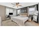 Inviting bedroom featuring a ceiling fan, a work area, and large windows at 1014 Solemn Cactus Ave, North Las Vegas, NV 89031