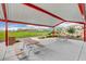 Covered picnic area with tables offers a relaxing outdoor space with a view of the community lawn and surrounding houses at 1014 Solemn Cactus Ave, North Las Vegas, NV 89031