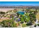 Aerial photo captures a vibrant community playground with modern equipment and mature trees at 1014 Solemn Cactus Ave, North Las Vegas, NV 89031
