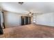 Large bedroom with carpet, ceiling fan, and built-in wardrobe at 10166 Monks Hood Ct, Las Vegas, NV 89183