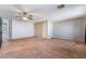 Spacious bedroom with carpet, ceiling fan, and ample natural light at 10166 Monks Hood Ct, Las Vegas, NV 89183