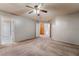 Empty bedroom featuring neutral walls, carpet, and a ceiling fan at 10166 Monks Hood Ct, Las Vegas, NV 89183