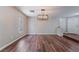 Dining area featuring stylish lighting, neutral walls, and wood flooring at 10166 Monks Hood Ct, Las Vegas, NV 89183
